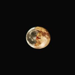 Low angle view of moon against sky at night