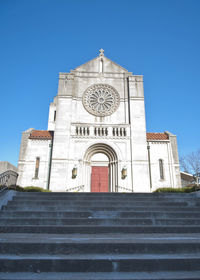 Low angle view of cathedral against clear blue sky