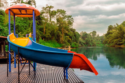 Slide on pier by lake