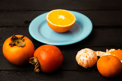 Close-up of orange fruits on table