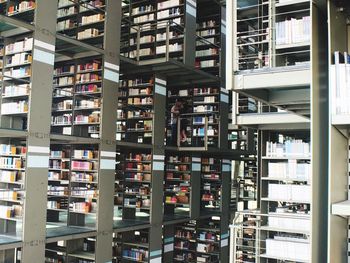 Man and woman embracing in library