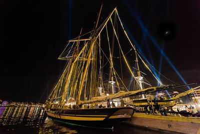 Illuminated suspension bridge in city at night