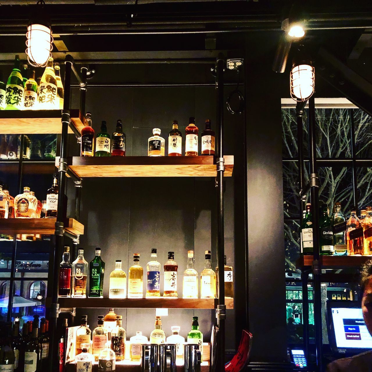 VIEW OF WINE BOTTLES ON SHELF