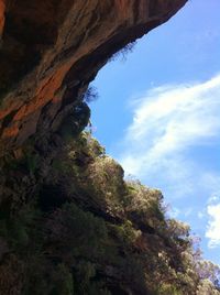 Low angle view of rock formation against sky