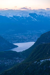 High angle view of snowcapped mountains against sky during sunset