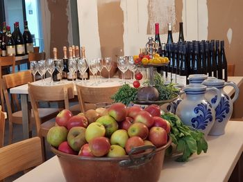 Fruits and vegetables in basket on table