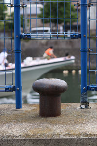 Close-up of metal fence against blurred background