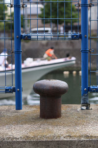 Close-up of metal fence against blurred background