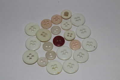 Directly above shot of coins over white background