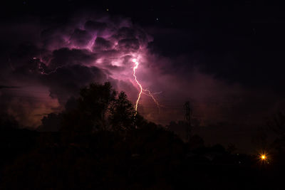Low angle view of lightning in sky at night