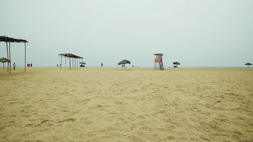 Scenic view of beach against clear sky