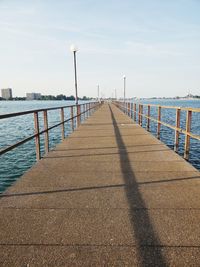 View of pier over sea against sky