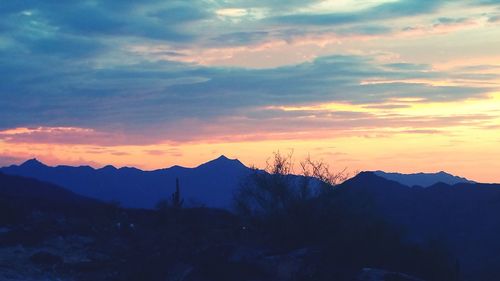 Scenic view of mountains at sunset