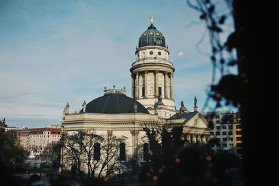 View of buildings in city against sky