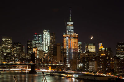 Illuminated buildings in city at night