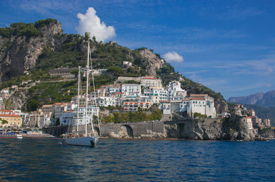 Sailboat in the harbor of amalfi city, costiera amalfitana, italy