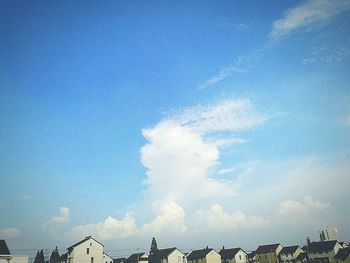 Low angle view of built structure against blue sky