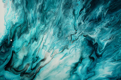 Fluid art. liquid dark turquoise abstract drips and wave. marble effect background or texture