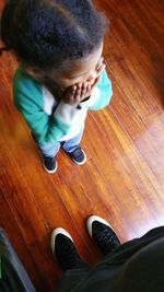 Low section of man sitting on floor