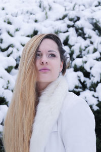 Portrait of young woman in snow