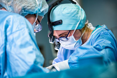 Surgeons performing surgery at hospital
