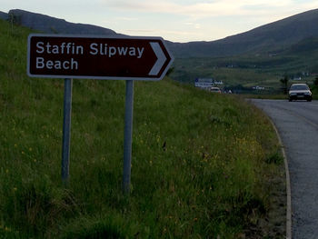 Information sign on grassy field