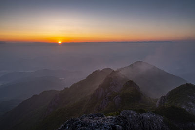 Scenic view of mountains against sky during sunset