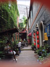 Man walking in front of building