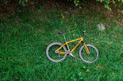 High angle view of bicycle parked on field