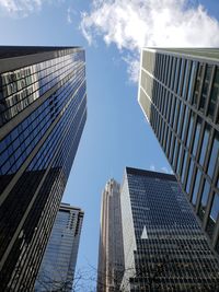 Low angle view of modern buildings against sky in city