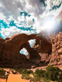 View of rock formation against cloudy sky