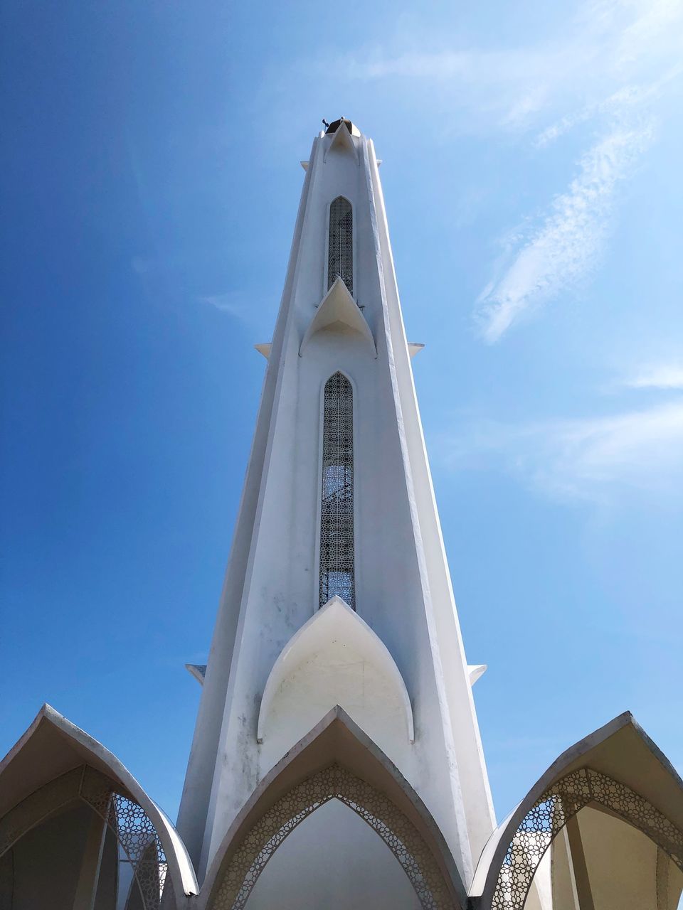 LOW ANGLE VIEW OF BUILDING AGAINST BLUE SKY