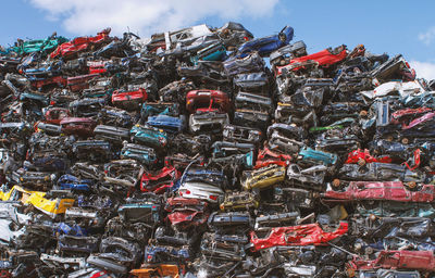 Stack of abandoned cars outdoors