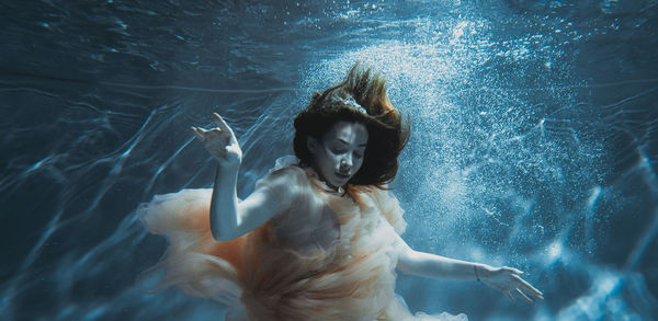 Woman swimming in pool