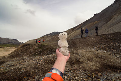 Close up small snowman in hand concept photo