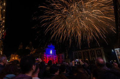 Firework display at night