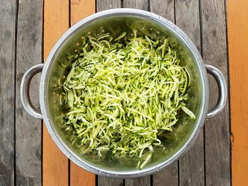 High angle view of chopped vegetables in bowl on table