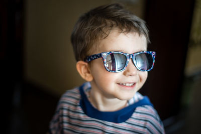 Portrait of cute boy wearing sunglasses