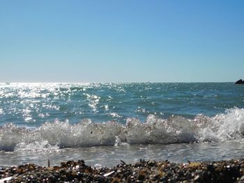 Scenic view of sea against clear sky