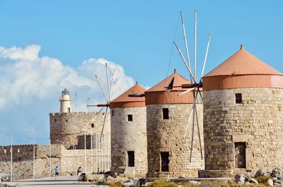 Buildings in city against sky