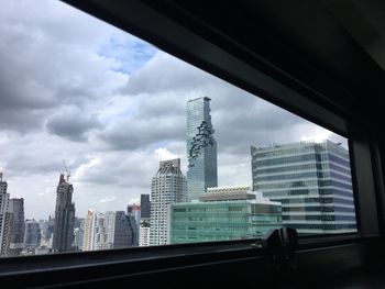 Modern buildings against sky in city