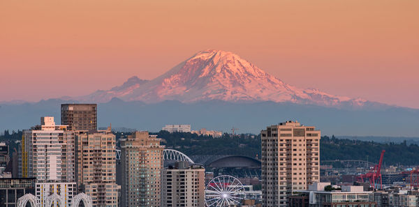 View of city against mountain during sunset