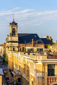 Buildings in city against sky