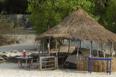 Lifeguard hut on beach against trees