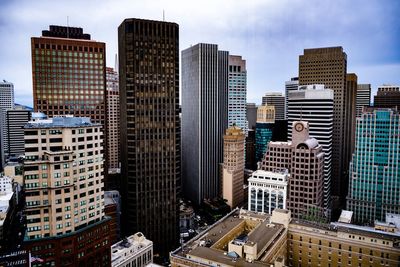 Modern buildings in city against sky