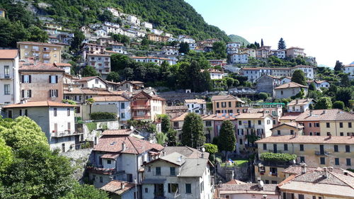 Houses in town against sky