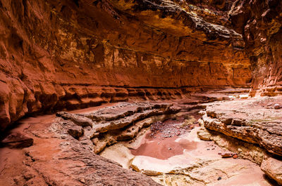 A subway like tunnel in a desert canyon.