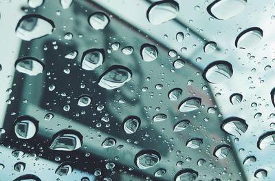 Full frame shot of raindrops on glass window