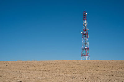 Communication tower with clear blue sky