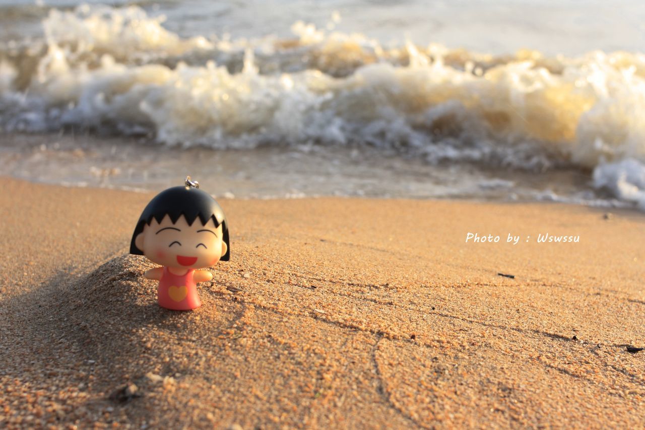 beach, sand, shore, childhood, sea, focus on foreground, summer, wave, carefree, day, getting away from it all, tranquility, outdoors, vacations, scenics, nature, tranquil scene